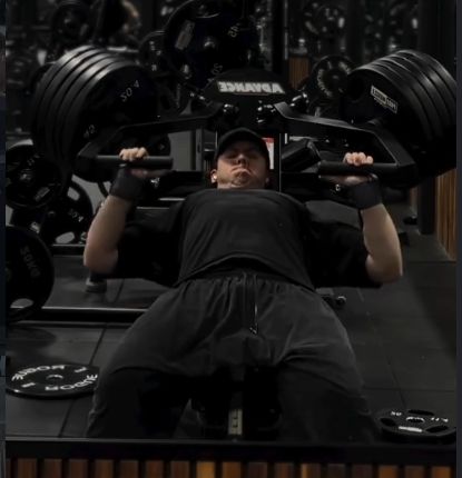 Sam on a plate-loaded chest press